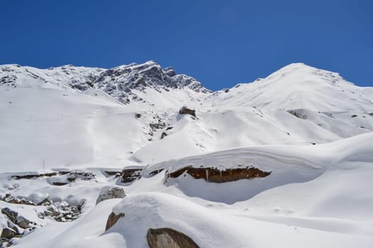 Snow-covered mountain peaks in Himalaya India. The Great Himalayas or Greater Himalayas probably is the highest mountain range of the Himalayan Range System.