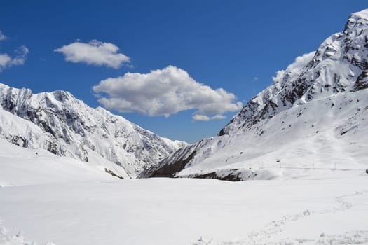 Snow-covered mountain peaks in Himalaya India. The Great Himalayas or Greater Himalayas probably is the highest mountain range of the Himalayan Range System.