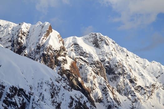 Snow-covered mountain peaks in Himalaya India. The Great Himalayas or Greater Himalayas probably is the highest mountain range of the Himalayan Range System.