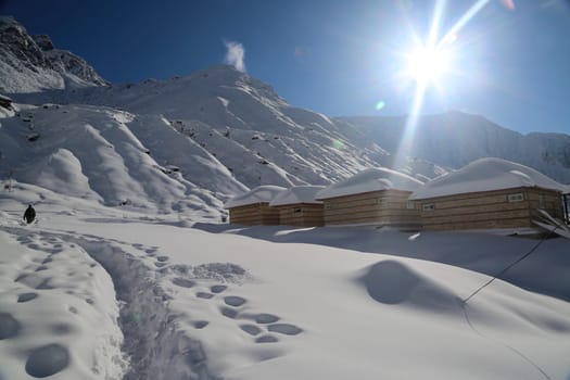 Snow covered peaks and mountain in Himalaya India. The Himalayas is a mountain range in Asia separating the plains of the Indian subcontinent from the Tibetan Plateau.