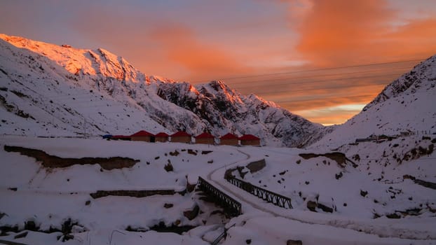 Snow covered mountain, sun rays in Himalayan state Uttarakhand. Dotted with long mountain ranges and glittering jewels in the world map, Uttarakhand is well-known for its glorious hill stations.