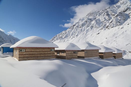 Snow covered peaks and mountain in Himalaya India. The Himalayas is a mountain range in Asia separating the plains of the Indian subcontinent from the Tibetan Plateau.