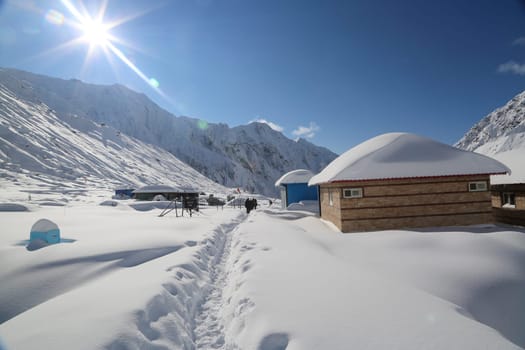 Snow covered peaks and mountain in Himalaya India. The Himalayas is a mountain range in Asia separating the plains of the Indian subcontinent from the Tibetan Plateau.