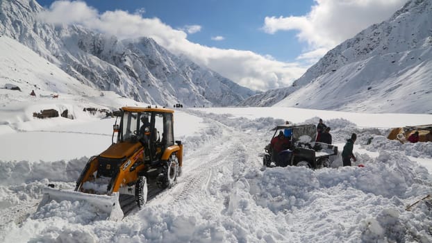 Rudarprayag, Uttarakhand, India, September 09 2014, JCB machine working in snowfall in kedarnath reconstruction. Government made a reconstruction plan for the Kedarnath temple area that was damaged in floods of 2013.
