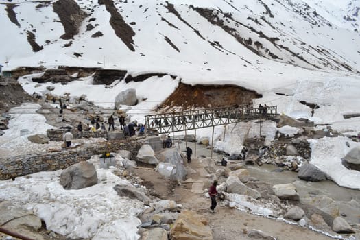 Laborers rebuilding bridge that collapsed in Kedarnath disaster. In June 2013, a multi-day cloudburst centered on the North Indian state of Uttarakhand caused devastating floods and landslides.