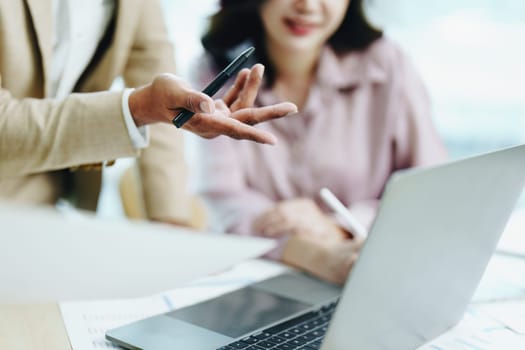 Asian entrepreneurs and business people meeting in a conference room in business planning, financial budget and investment risk assessment to analyze customer groups to increase company growth.