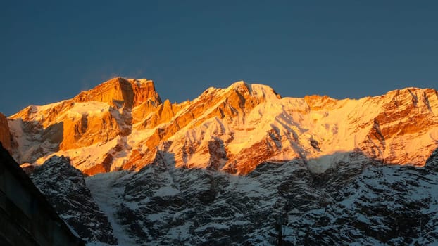 Snow covered mountain shining with the sun rays in Himalaya. The Himalayas are home to some of the most exotic locations in the world, featuring the highest peaks on Earth, snow-clad landscapes,