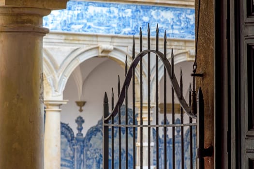 Arches and gate in the inner courtyard of an old historic convent in the city of Salvador, Bahia