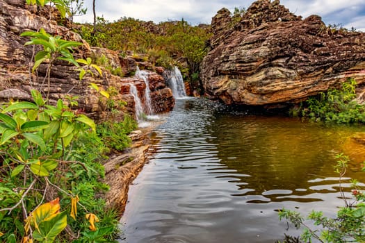 Beautiful river and waterfalls among the preserved vegetation of the Biribiri environmental reserve in Diamantina, Minas Gerais, Brazil