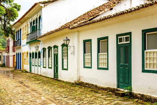 Bucolic street with cobblestone pavement and historic colonial-style houses from the empire era in the city of Paraty on the coast of Rio de Janeiro