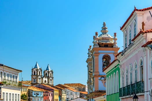 Colorful facades and historic church towers in baroque and colonial style in the famous Pelourinho neighborhood of Salvador, Bahia