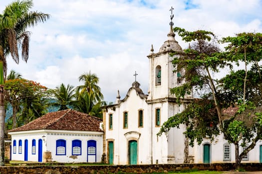 Famous church between th vegetation in the ancient and historic city of Paraty on the south coast of the state of Rio de Janeiro founded in the 17th century