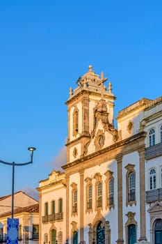 Facade of an old and historic church from the 18th century in the central square of the Pelourinho district in the city of Salvador, Bahia at afternoon