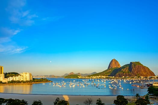 Guanabara Bay and Botafogo Beach and its boats with the Sugarloaf Mountain in the background in the city of Rio de Janeiro