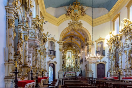 Interior of richly decorated historic Brazilian baroque church in Ouro Preto city in Minas Gerais, Brazil