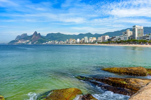 Ipanema beach in Rio de Janeiro still empty with its buildings and mountains around