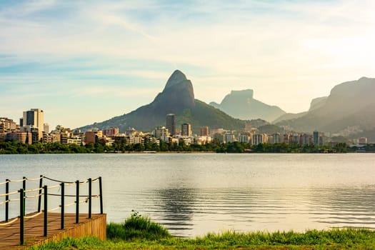 Late afternoon at Rodrigo de Freitas lagoon in Rio de Janeiro with views of the city buildings and mountains