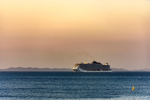 Luxury cruise ship arriving in the city of Salvador in Bahia during summer sunset
