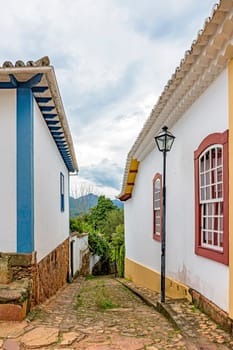 Old colonial-style alley with cobblestone street in the historic city of Tiradentes in Minas Gerais