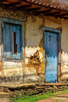 Old and deteriorated house made with rudimentary and ancient colonial-style construction techniques in Ouro Preto