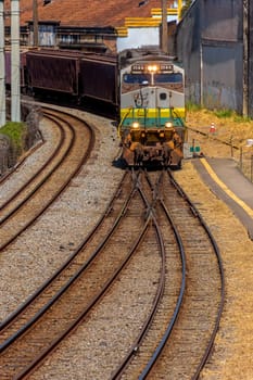 Old freight train worn out by time and use arriving in the city of Belo Horizonte, Minas Gerais