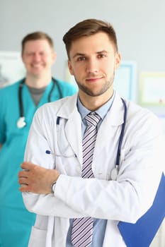 Medical team of doctors men looking at camera and smiling. Medical professional service and insurance concept