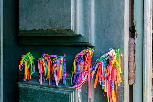 Famous ribbons of good luck from Our Lord of Bonfim tied to the door of the church in Salvador, Bahia
