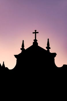 Silhouette of a colonial-style historic church during sunset in the Pelourinho neighborhood in the city of Salvador, Bahia.