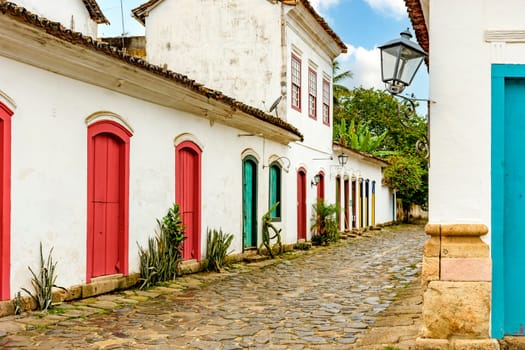 Street with cobblestone pavement and facades of old colonial houses in the historic city of Paraty in the state of Rio de Janeiro