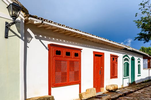 Street with ancient colonial style houses with colorful doors and windows in the historic city of Tiradentes in Minas Gerais, Brazil