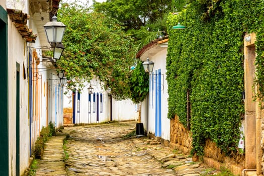 Streets of cobblestone and old historical houses in colonial style on the streets of the old and historic city of Paraty founded in the 17th century on the coast of the state of Rio de Janeiro, Brazil