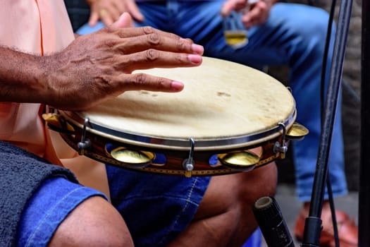 Tambourine being played by a ritimist during a samba performance in Rio de Janeiro