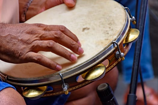 Tambourine being played by a ritimist during a samba performance in Rio de Janeiro, Brazil