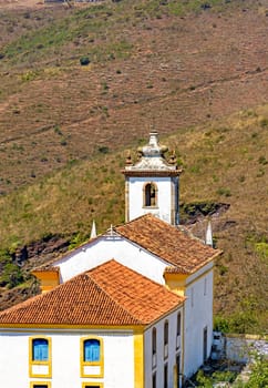 View from behind of old and historic church in colonial architecture from the 18th century in the city of Ouro Preto in Minas Gerais, Brazil
