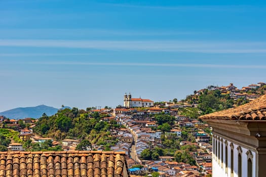 View of the houses, roofs, hills and churches of the historic city of Ouro Preto in Minas Gerais, Brazil