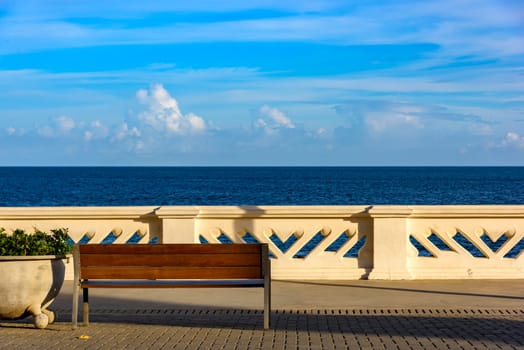 Wall and sidewalk overlooking the sea on a summer afternoon in the city of Salvador, Bahia