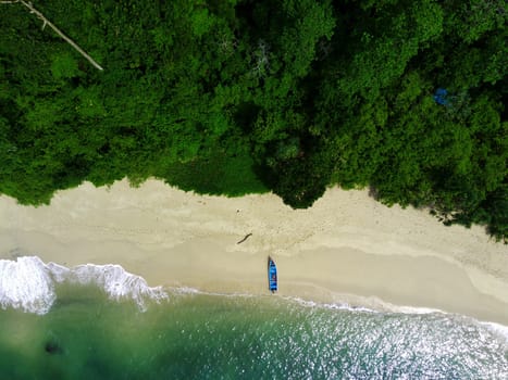 Aerial photo of a Traditional boat moored on the beach in Teluk Ijo, Banyuwangi. Indonesia.