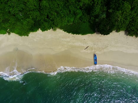 Aerial photo of a Traditional boat moored on the beach in Teluk Ijo, Banyuwangi. Indonesia.