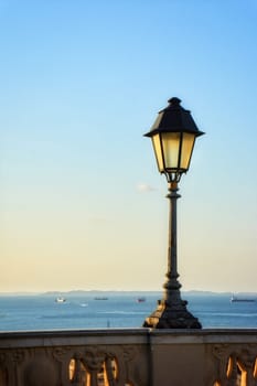 Old lamppost on the walls of the streets of Pelourinho in Salvador city, Bahia during summer sunset.