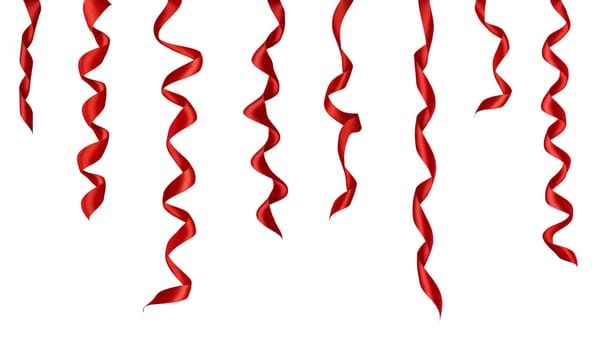 collection of various red ribbon pieces on white background. each one is shot separately