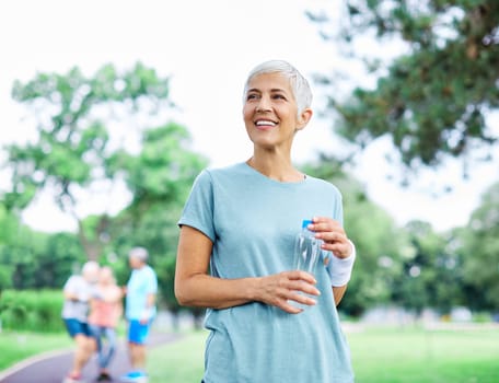 Portrait of a happy active beautiful senior woman posing after exercicing outdoors