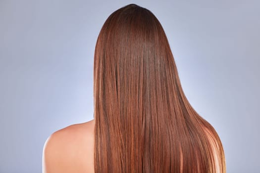 Hair, model and back of a woman with beauty, wellness and soft hairstyle texture in a studio. Cosmetics, shampoo treatment and keratin of a female with healthy, clean and haircare shine from salon.