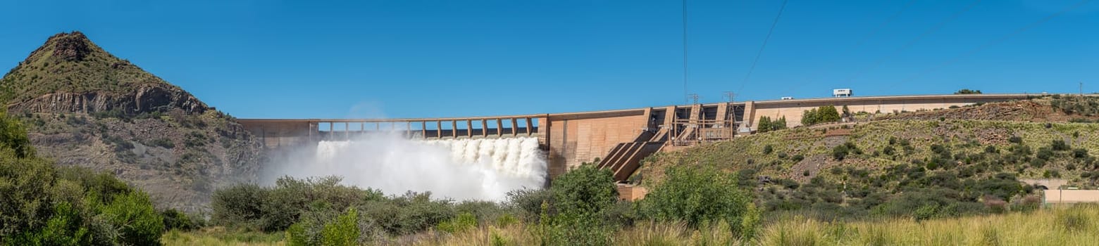 Panorama of the Vanderkloof Dam overflowing. It is the second largest dam in South Africa. It has the tallest dam wall in South Africa