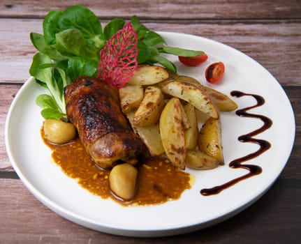 Recipe for boneless rolled chicken leg with potatoes and molasses-flavoured mache salad, High quality photo