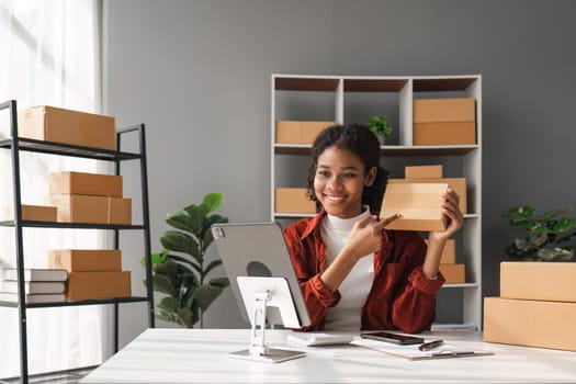 Beautiful African Americans woman live streaming at her shop. Business online influencer on social media concept. Online Selling. Online Shopping.