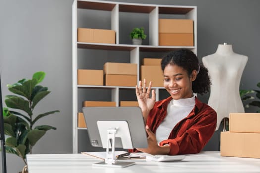 Beautiful African Americans woman live streaming at her shop. Business online influencer on social media concept. Online Selling. Online Shopping.