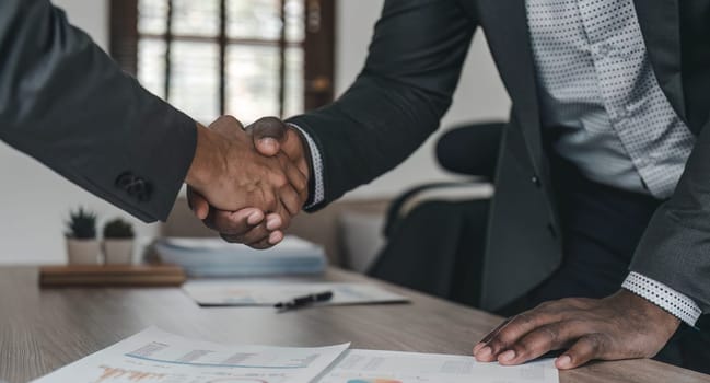 Businessmen making handshake with partner, greeting, dealing, merger and acquisition, business cooperation concept, for business, finance and investment background, teamwork and successful business..