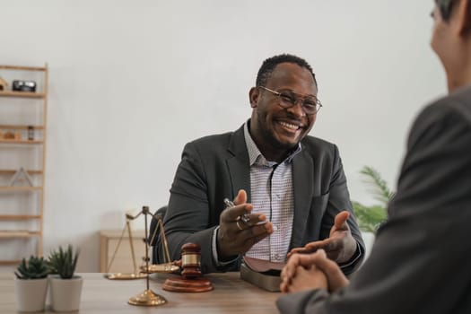 Business team and lawyers discussing contract papers sitting at the table. Concepts of law, advice, legal services. at office..