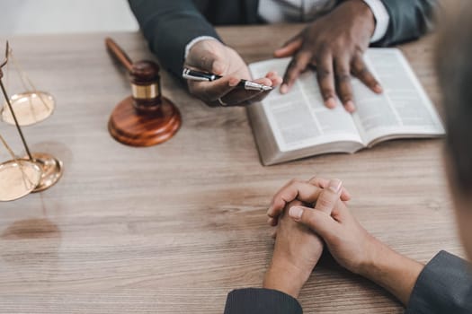 Business team and lawyers discussing contract papers sitting at the table. Concepts of law, advice, legal services. at office..