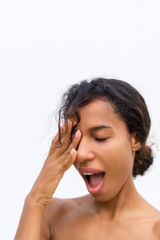 Beauty portrait of young topless african american woman with bare shoulders on white background with perfect skin and natural makeup positive